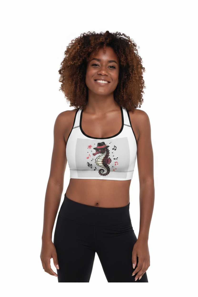 Woman with curly hair wearing white padded racerback sports bra with black trim and colorful seahorse floral graphic, paired with black leggings
