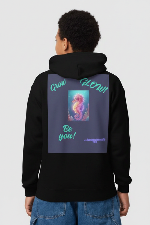 Young person from the back wearing black youth hoodie with neon seahorse graphic and Grow Glow Be You text on the back